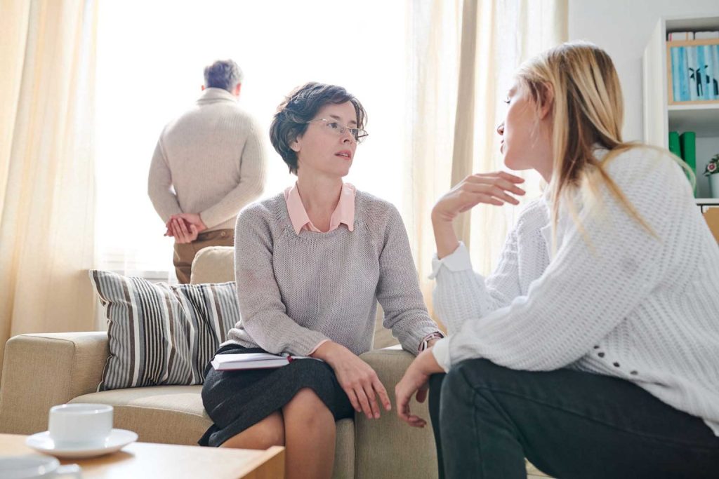 psychologist listening to anxiety of married woman AESNHGL 1536x1024 1 1